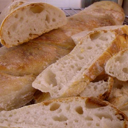 imgp5460[1].jpg - My latest baguettes. They were really good. I chomped half a loaf as soon as it came out of the oven. One of my many vices :)